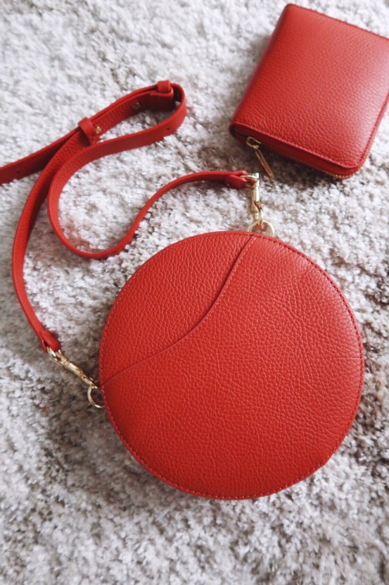 Cuyana Mini Circle Bag in 'blood orange' leather with matching small zip around wallet